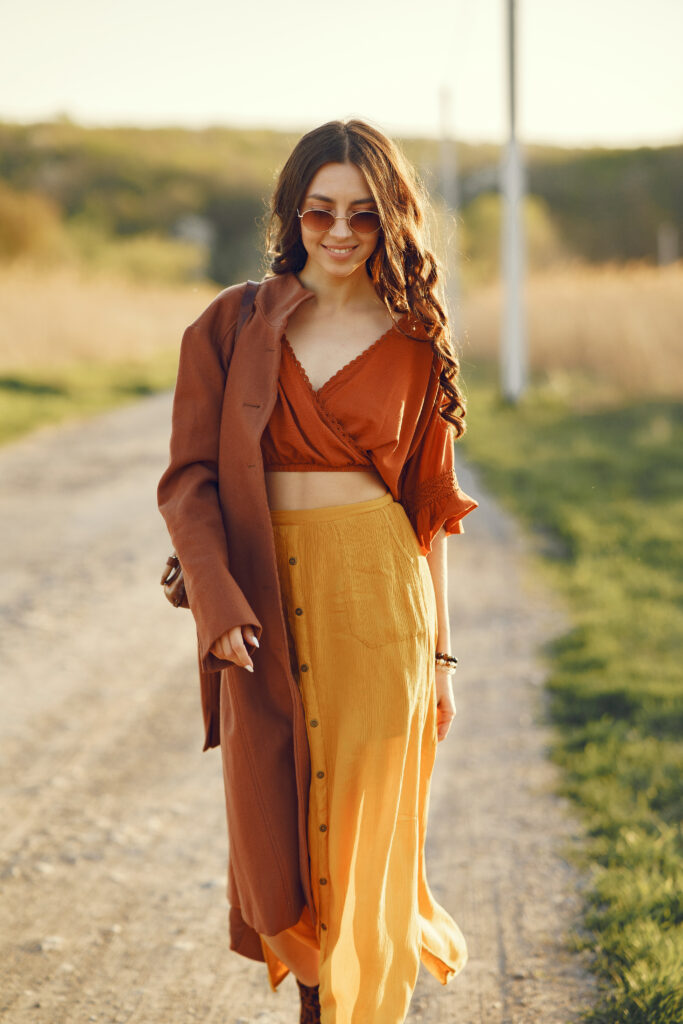 Stylish woman spending time in a summer field